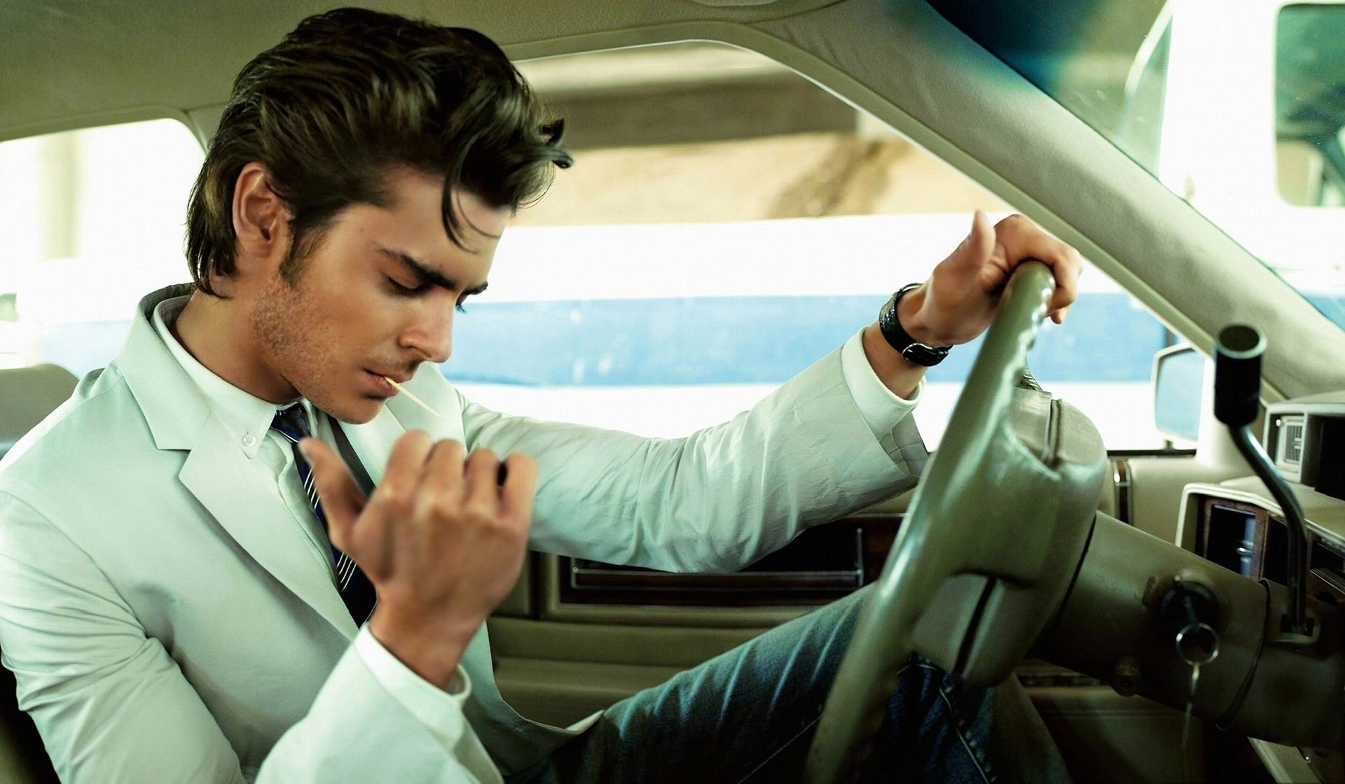 man euphoria toothpick white jacket zac efron car hairstyle steering wheel salon car guy watch face passenger cars cars transport