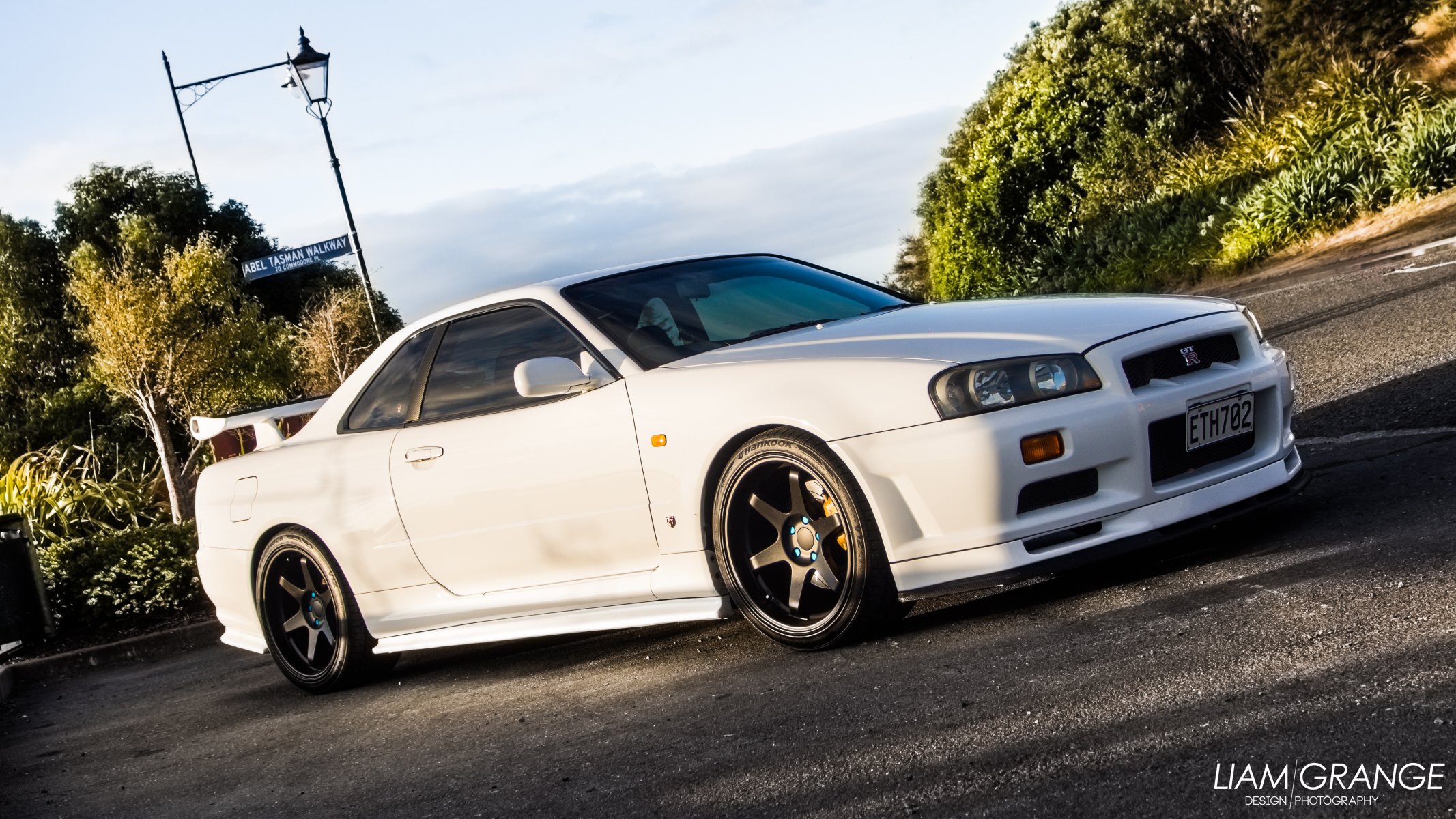 nissan skyline gtp gt-r r34 vspec v-spezifikation jdm auto nissan skyline gelb gelb auto sonnenuntergang rasse räder wolf strahlen reifen hankook liam grange