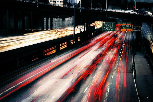 Night traffic on the motorway in the city