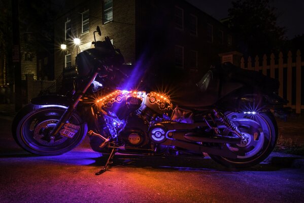 Harley-davidson bike in multicolored light