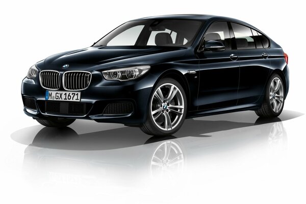 Black BMW 550i on a white background