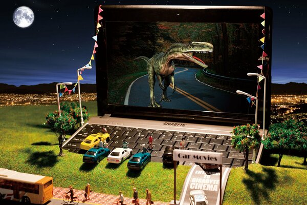 Miniature de cinéma avec un grand jeu sur lequel le dinosaure court