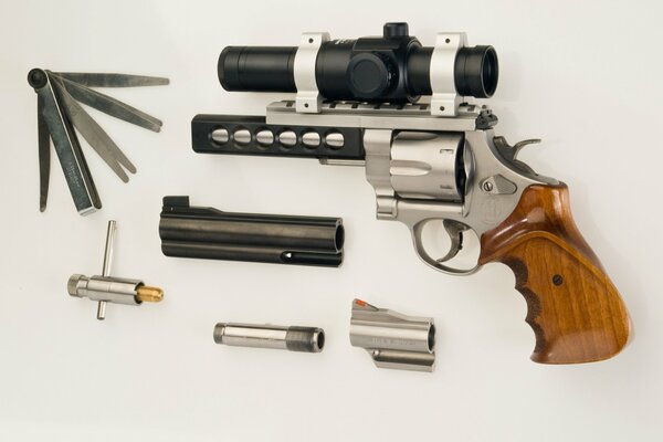 Disassembled pistol revolver on a white background