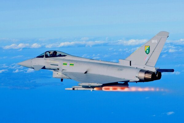 Silver eurofighter typhoon fighter in the sky