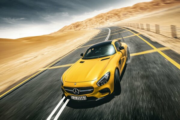 Yellow Mercedes Benz on a deserted road