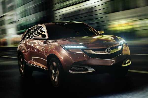 El SUV acura vuela por la ciudad nocturna