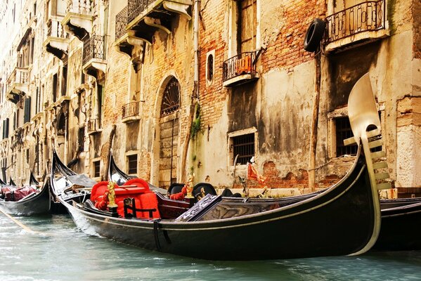 Gondola on the background of an old building in Venice