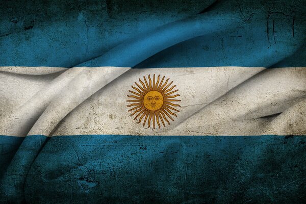 Die Sonne auf der argentinischen Flagge mit Falten