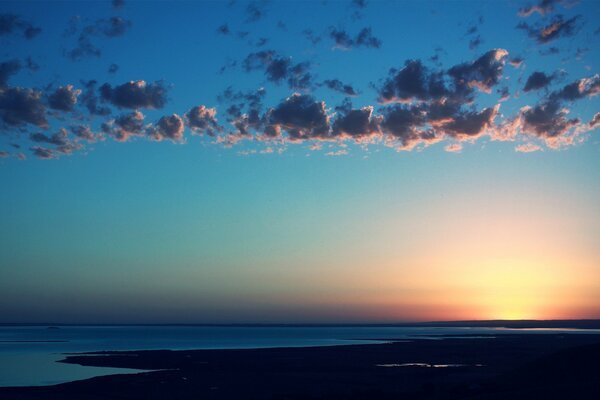 Sunset on the seashore in calm weather