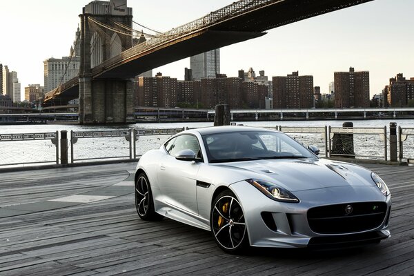 Jaguar, f - type r (USA) 2015 on the background of the bridge