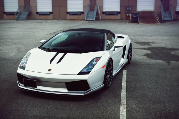 Sports car on the background of warehouses