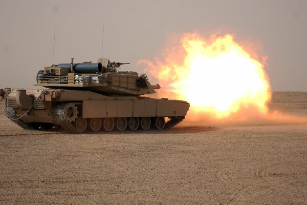 A volley from a tank in the desert is a huge ball of fire