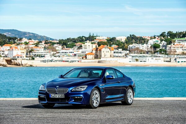 Coupe sport, maked against the background of the city