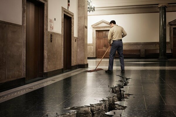 cleaner high-quality washes the floor in the hall