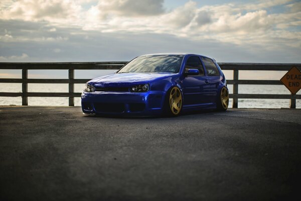 Blue Volkswagen Golf with alloy wheels