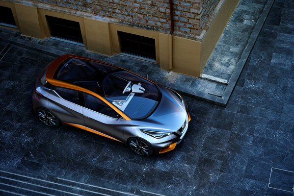 Top view of a beautiful car standing at the house