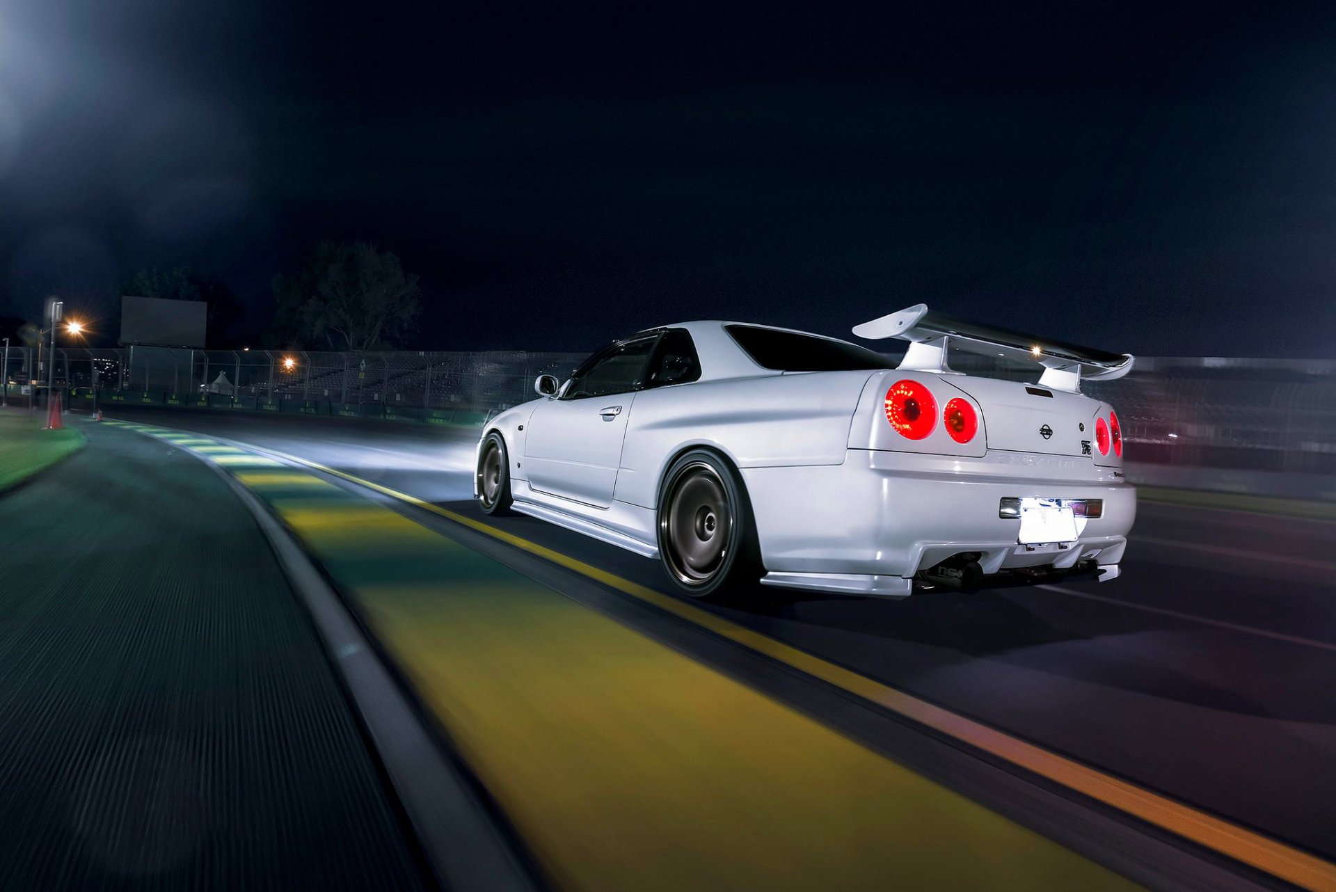 nissan skyline r34 white car race track nigth dark rear speed