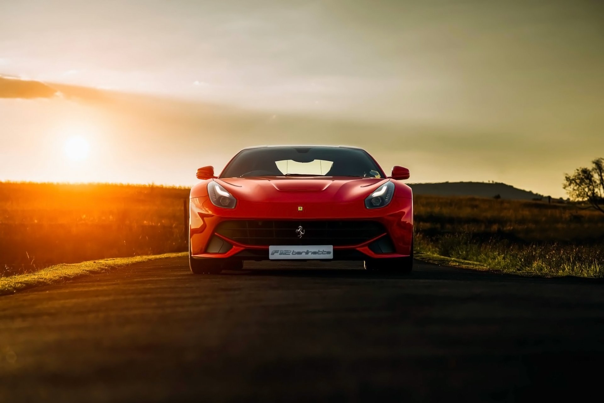 ferrari f12 berlinetta rouge coucher de soleil avant supercar sud afrique