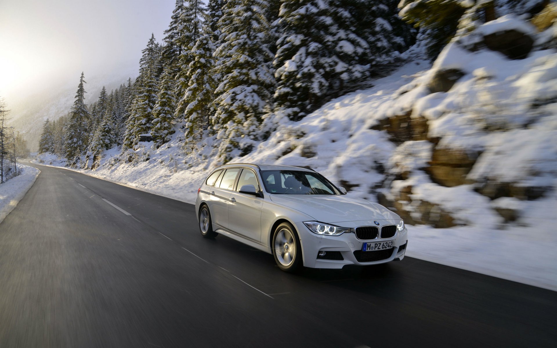 bmw 320d f31 white station wagon snow road in motion auto bmw