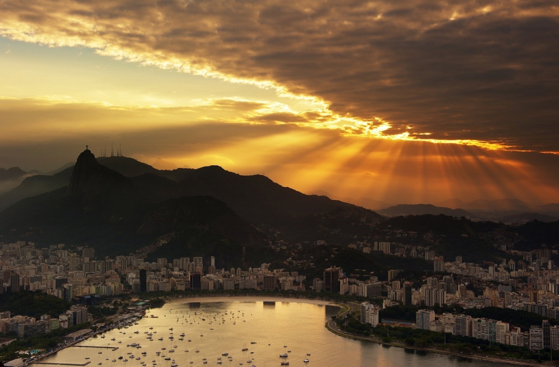 brasilien rio de janeiro sonnenuntergang himmel wolken wolkenkratzer ozean boote stadt nacht