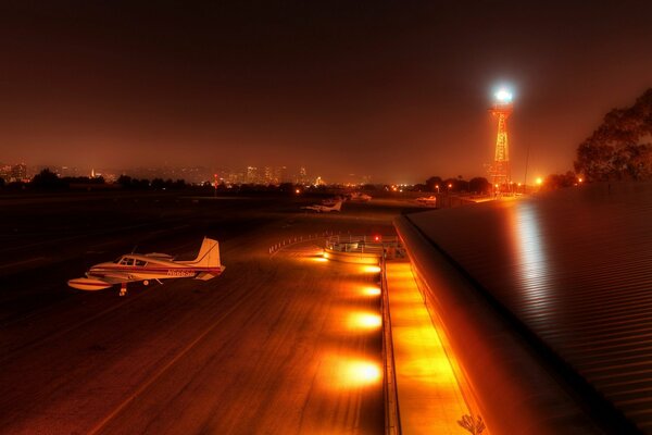 The plane is at the airport on the runway