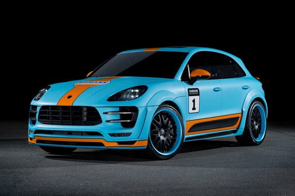 A blue Porsche Cayenne with an orange stripe