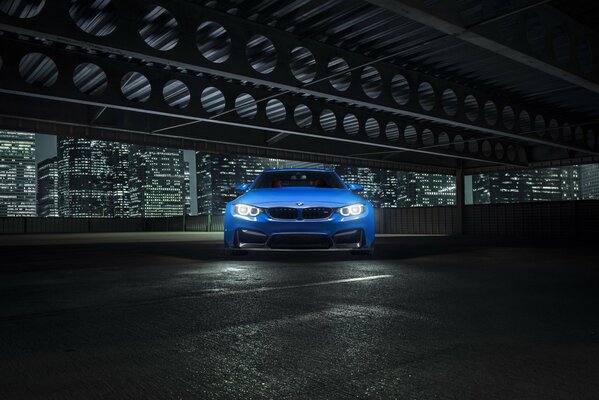 Photo shoot of the blue vorsteiner gtrs4 on the background of the night city