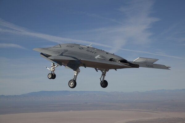 Unmanned aerial vehicle in the air over the plain