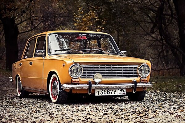 Car tuning VAZ 2101. Zhiguli yellow on the background of autumn