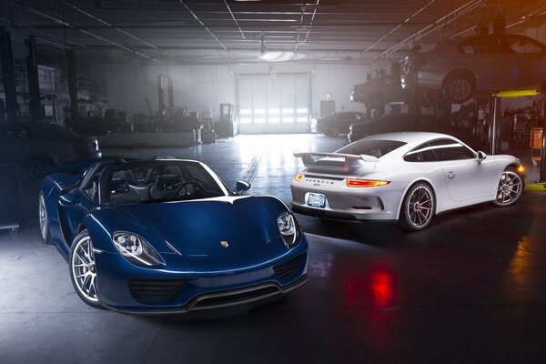 2 new porsches are in the workshop