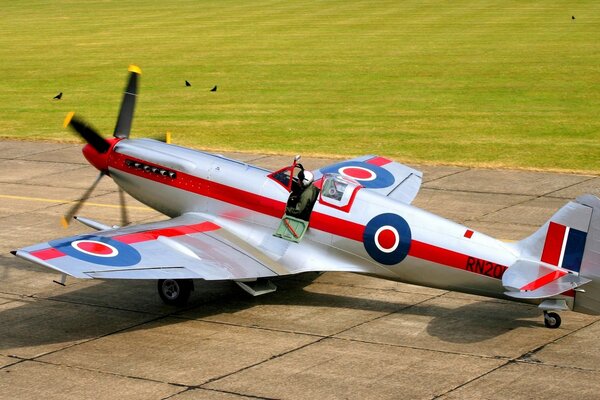 A small plane on the tarmac on a sunny day