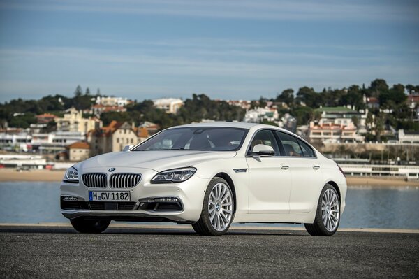 White BMW on the background of the city