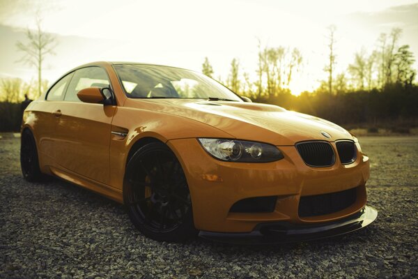 Orange BMW at sunset