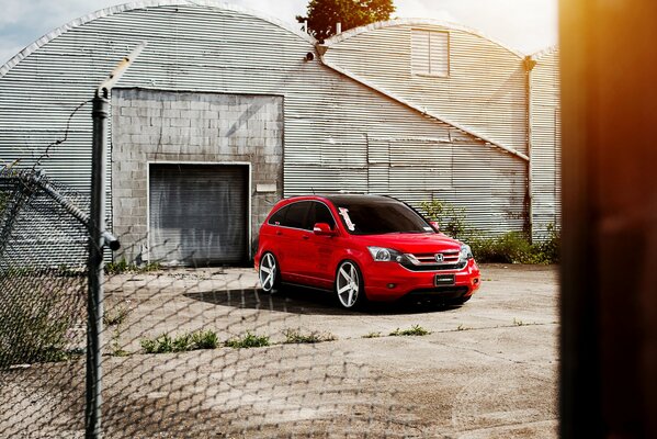Beautiful red car. A bright car on a nondescript background