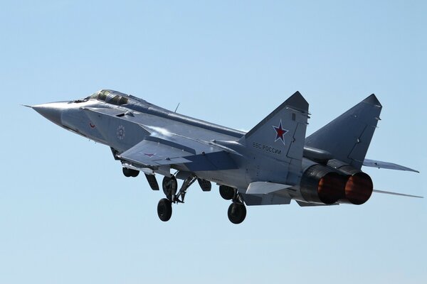 Two-seat fighter in flight against the sky