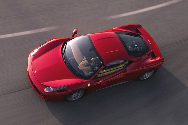 Top view of a red Ferrari on the road