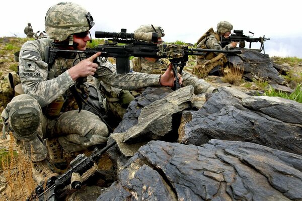 US Army riflemen are sitting in ambush