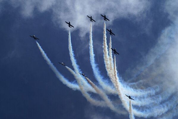 At demonstration performances, planes leave white plumes in the air