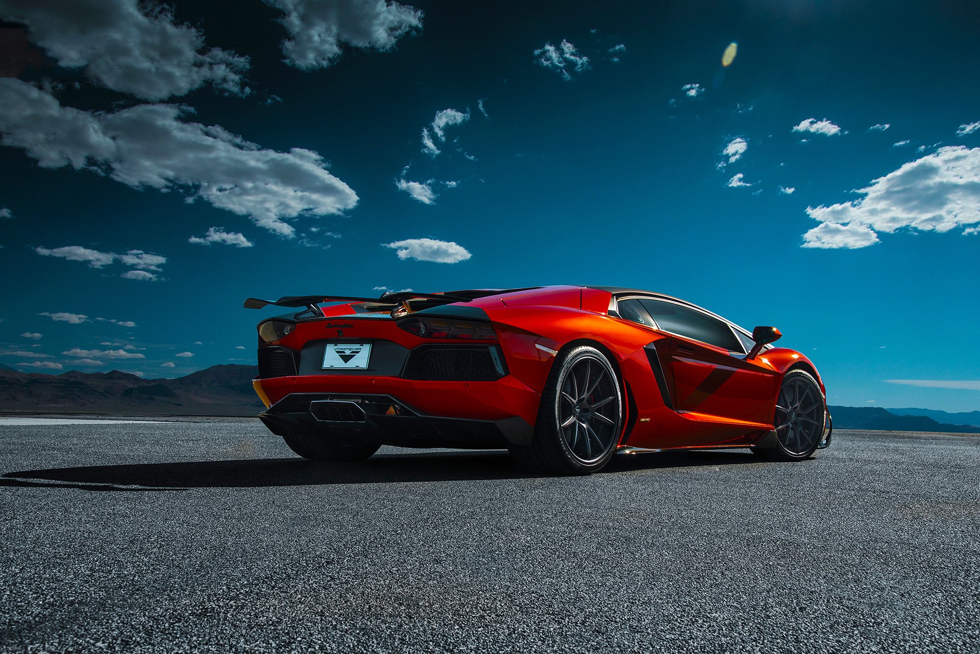 lamborghini aventador-v lp740-4 saragossa vorsteiner supersportwagen orange hinten wüste himmel wolken