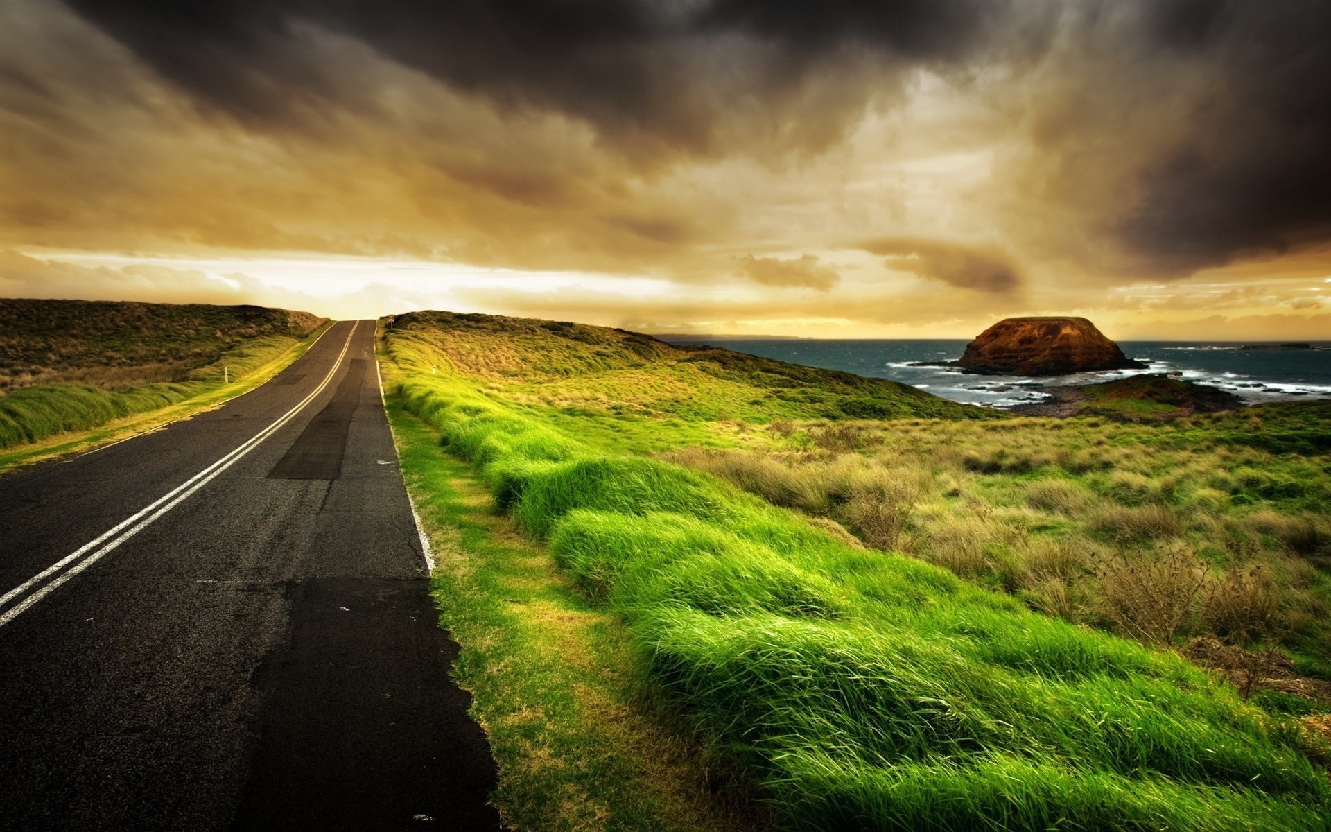 grass water roads landscapes rock road sea stones photo stone rocks ocean clouds shore surf horizon distance marking greenery clouds landscape