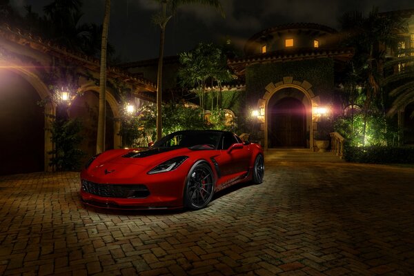 Red Chevrolet on the streets of the night city