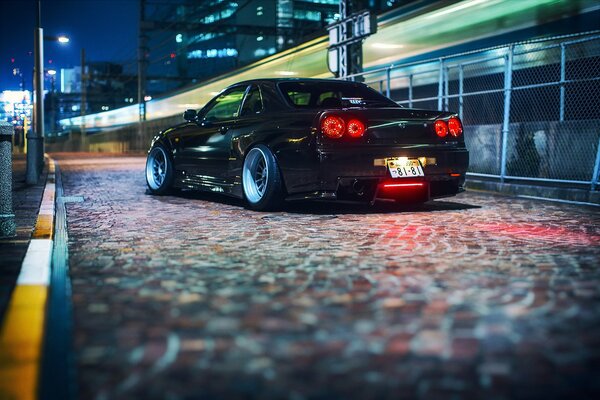 Sports Nissan illuminated at night on the street