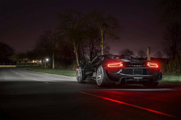 A sports car rides on the night street