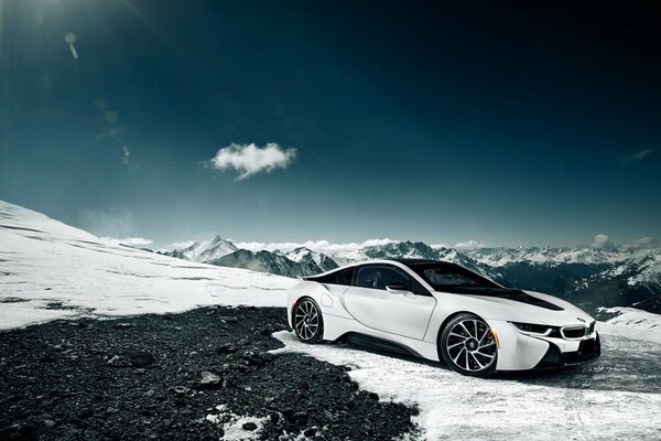 Bmw i8 white snow burning sun blue sky and shiny bmw i8