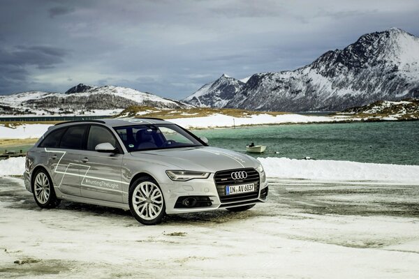 Silver Audi on the background of mountains