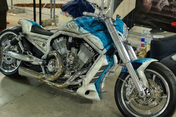 A stylish motorcycle in a blue and white range of unusual design