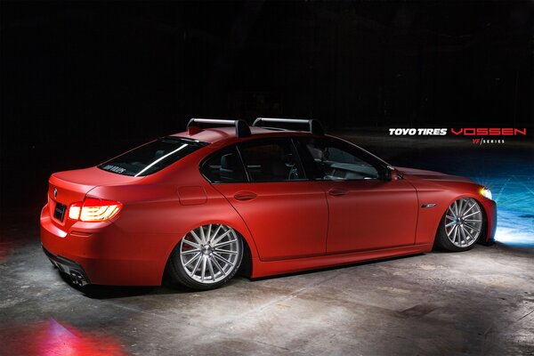 Lowered to the floor red BMW car