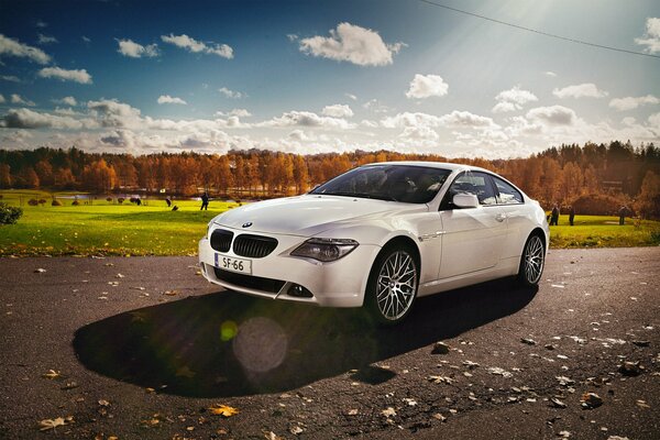 White bmw, e63 on a landscape background