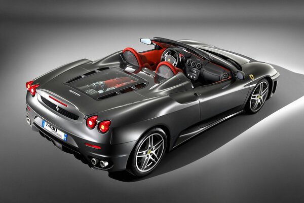 Grey Ferrari with red interior upholstery