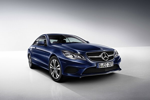 Blue Mercedes Benz on a white background